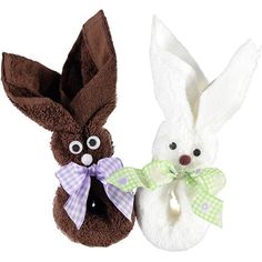 two stuffed bunnies with eyes and ears, one has a bow tie on it