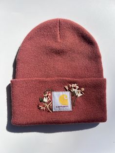 Dusty pink carhartt beanie with hand embroidered flowers! Pink Carhart Beanie, Embroidered Carhartt Beanie, Pink Carhartt Beanie, Bonnet Carhartt, Carhartt Cap, Pink Carhartt, Embroidered Carhartt, Carhartt Beanie, Hand Embroidered Flowers