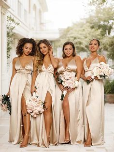 the bridesmaids are all wearing different dresses