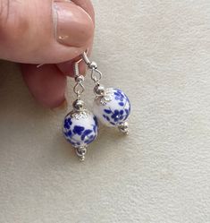 Blue Porcelain Earrings,Porcelain China earrings, Blue Silver  Earrings, Ceramic Bead Earrings, Blue White Flower Earrings, Mothers Day Gift, Gifts For Her, Birthday Gift Oriental themed porcelain floral earrings in the colours of blue flowers on white background. To capture each of the round beads, I have decorated the beads with silver plated scallop filigree to gifts it a bright fresh contrasting look. Packaging: Earrings comes wrapped in tissue paper, a lovely organza pouch with a personal B Blue China Earrings, Ceramic Beads Jewelry, Blue And White Jewelry, Packaging Earrings, Blue And White Earrings, White Flower Earrings, China Earrings, Earrings Ceramic, White Flower Earring