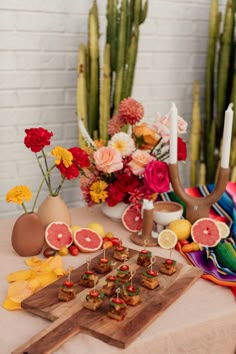 a table topped with food and flowers on top of it