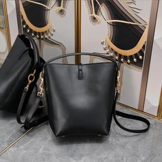 Designer Calfskin Bucket Bag: Genuine Leather, Crossbody Style with Large Capacity Luxury Large Capacity Bucket Bag For On-the-go, Luxury Bucket-shape Shoulder Bag For On-the-go, Leather Bucket Satchel For On-the-go, Chic Bucket-shaped Hobo Bag For On-the-go, Luxury Black Bucket Box Bag, Modern Bucket Bag For Office, Luxury Bucket Box Bag For Everyday Use, Luxury Bucket-shape Box Bag For Everyday Use, Modern Office Bucket Bag