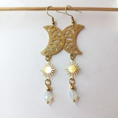 Ethereal Handmade Dangle Jewelry, Handmade Ethereal Dangle Jewelry, Brass Dangle Chandelier Earrings For Festivals, Bohemian Moon Phase Dangle Earrings, Bohemian Moon Phase Earrings For Festivals, Bohemian Jewelry With Dangle Moon Charm, Festival Sun And Moon Dangle Jewelry, Dangle Brass Moon Charm Jewelry, Brass Dangle Jewelry With Moon Charm