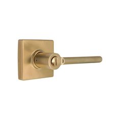 a brass door handle on a white background