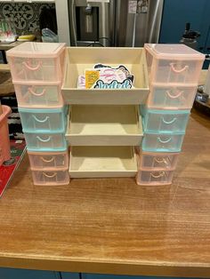 plastic drawers are stacked on top of each other in the middle of a kitchen counter