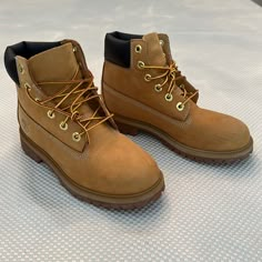 Junior Timberland Premium 6-Inch Waterproof Boot Size 5. Excellent Condition. Worn A Few Times Before Outgrown. No Rips, Tears Or Stains. Just Normal Wear To The Wheat Nubuck From Being Worn A Few Times. Soles Show No Wear. No Oils, Sprays Or Additives Have Been Applied To These Boots. They Have Been Brushed. A Brand New Pair Will Look More Worn After One Day. This Is An Excellent Buy! Timberland Gaiter Boots, Boots For Streetwear With Round Toe, Timberland Winter Work Boots With Round Toe, Casual Yellow Work Boots For Outdoor, Timberland Waterproof Boots With Round Toe, Timberland Yellow Winter Boots, Yellow Timberland Boots For Winter, Timberland Insulated Waterproof Casual Boots, Timberland Casual Insulated Waterproof Boots