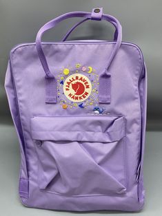 Welcome to my store and choose the perfect hand-embroidered fjallraven kanken backpack   Version & Size + Medium size: 38x27x13cm  + Big size: 42x32x13cm  - Product price includes: hand-embroidered fjallraven kanken backpack and design as shown in the picture - I can make fjallraven kanken backpack hand embroidery patterns according to your ideas - fjallraven kanken backpack will be hand embroidered with thread that won't fade when washed - fjallraven kanken backpack has a small front compartmen Trendy Embroidered Backpack For Travel, Casual Backpack With Embroidered Logo For Daily Use, Casual Backpack With Embroidered Logo, Fjallraven Kanken Embroidered, Planets Embroidery, Embroidery Theme, Kanken Classic, Fjall Raven, Stitch Backpack