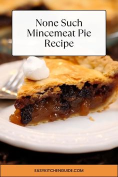 a slice of pie on a white plate with a fork next to it that says, none such minemeat pie recipe