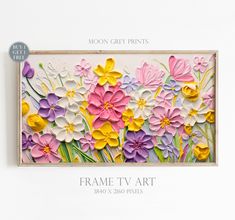 the frame is made out of paper and has flowers painted on it