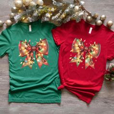 Christmas Bow T-shirt, Christmas Light Coquette Bow shirt, Couples Tee for Christmas Eve Party T-shirt, Xmas Holiday Themed Tee Check it out our other Most Likely To Shirts and Sweatshirts; https://www.etsy.com/shop/MyNewCustomTshirt?section_id=45667553 Our personalized t-shirts are made from high-quality materials that feels great against your skin. With a range of colors and designs to choose from, you're sure to find a shirt that matches your personality and style. Whether you're looking for a funny graphic tee, a statement piece with bold, eye-catching artwork, or a classic design with a twist, we have something for everyone. Perfect for casual outings, concerts, or even just lounging around the house, our t-shirts are comfortable, stylish, and versatile. Plus, they make great gifts fo Red Short Sleeve Top For Holidays, Red Short Sleeve Holiday Top, Festive Christmas Crew Neck T-shirt, Christmas Holiday Crew Neck Shirt, Christmas Party T-shirt With Graphic Print, Festive Red Short Sleeve Shirt, Green Holiday Top For Christmas, Festive Holiday Graphic Print T-shirt, Green Christmas Holiday Top