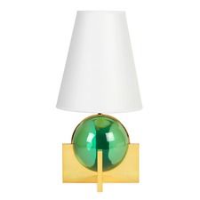 a green lamp with a white shade on the base and a wooden block underneath it