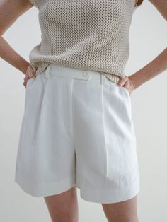 A complimentary piece to our Fauna Blazer, these shorts simply say: “classic and clean.” They are those basic white shorts you’ve been looking for—the ones you’ll wear to the park one day with a tee, and then the next day to a fancy event. The silhouette is flattering, and the length works for truly any occasion. Made of structured, yet soft linen, they also have adjustable buttons inside the waistband for your unique waistline. These are a go-to for years to come, reminding you that time is on Fancy Event, Lounge Party, Simple Tshirt, Wool Vest, The Next Day, Sleeveless Sweater, Workout Wear, Grey Sweater, The Park