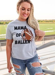 Football moms, get ready to score big on style and comfort with our premium football mom shirts! Made from high-quality materials and featuring trendy designs, our shirts are the perfect way to show off your love for the game. Whether you're cheering on your child from the stands or just want to show off your football mom pride, our shirts are the ultimate choice - order now and kick off your game-day wardrobe with a touchdown! The Bella+Canvas 3001 shirt is a unisex, lightweight, and versatile Game Day Pre-shrunk Athletic Heather Tops, Game Day Tops In Athletic Heather, Athletic Heather Sports Fan Top For Game Day, Athletic Heather Tops For Sports Fans On Game Day, Pre-shrunk Football Season Sports Fan Shirt, Pre-shrunk Sports Fan Shirt For Football Season, Cotton Tops With Heat Transfer Vinyl For Football Season, Sports Fan Shirt For Game Day, Game Day Football Shirt For Sports Fans