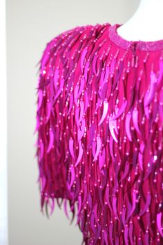 "Just such a Fun Stunning Dress this dress is pink and oh so fun!! With catail beads and sequins..this is just a fun dress to wear! I see no flaws, Very good to Excellent condition Measuring: 37\" long Bust: 36\" Waist: 30\" Hip: 36\" Shake shimmer and shine!! Pet Free/smoke free Enjoy!" Pink Embellished Sequin Fabric For Cocktail, Pink Sequin Mini Length Fabric For Party, Pink Sequin Fabric For Party, Mini Length, Pink Sequin Fabric For Spring, Pink Sequin Fabric For Prom, Pink Sequin Fabric For Spring Cocktail, Pink Fitted Sequin Fabric For Party Season, Fitted Pink Sequin Fabric For Night Out, Fitted Pink Sequin Fabric For Party Season