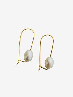 FLOATING THROUGH LIFE WHAT IT IS: A fresh water pearl elegantly dangling on a gold vermeil wire. WHY IT'S SPECIAL: These chic and modern dangle earrings feature a lustrous white freshwater pearl that seems to float below your ears. Freshwater pearls are unique and one of a kind so sizes and shapes will vary, which makes them extra special. GOOD TO KNOW: Gold VermeilFreshwater PearlWire Drop Length: 3/4" Pearl Jewellry, Hammered Gold, Fresh Water Pearl, White Freshwater Pearl, Chic Look, Rock A, Pearl Earrings Dangle, Gold Wire, Wire Earrings