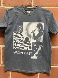 Broadcast fan art shirt. Hand screened in white ink on denim blue Comfort Colors t-shirts. Pop Culture Cotton T-shirt With Graphic Print, Pre-shrunk Band Merch T-shirt For Fan Conventions, Casual T-shirt With Screen Print For Fan Gatherings, Unisex Cotton T-shirt With Graffiti Print, Pop Culture Graphic Print T-shirt, Cotton Graphic Design Tops For Fan Merchandise, Fan Apparel T-shirt With Screen Print, Cotton Band Merch T-shirt, Graphic Tee Shirt For Fan Gear