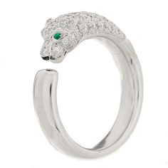 This is an authentic CARTIER 18K White Gold Diamond Black Onyx Emerald Panthere De Cartier Ring 55 7.25. The ring is crafted of 18-karat white gold and features a panther shape encrusted with diamonds weighing approximately .68 total carat weight with a black onyx nose and two emerald eyes. Luxury Diamond White Ring With Polished Finish, Luxury Diamond White Rings With Polished Finish, White Cartier Ring - Fine Jewelry, White Cartier Rings In Fine Jewelry, Luxury Cartier Rings In Diamond White, White Cartier Fine Jewelry Ring, Luxury 14k White Gold Jewelry, Cartier White Fine Jewelry Rings, Luxury Silver Emerald Ring With Brilliant Cut