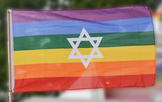 a rainbow flag with the star of david on it