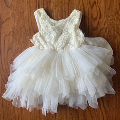 Reposhed! Ordered For My Daughter For A Wedding But She Wasn’t Able To Attend. Never Worn By Us! Cream Sleeveless Princess Tutu Dress, Cream Princess Style Sleeveless Baptism Dress, Cream Tulle Dress For Dress-up, Princess Style Cream Tutu Dress For Spring, Spring Princess Cream Tutu Dress, Cream Ruffled Baptism Dress For Dress-up, Spring Cream Tutu Dress Made Of Tulle, Spring Cream Tutu Dress In Tulle, Spring White Tutu Dress With Lace Bodice