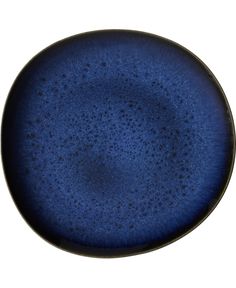 a blue plate sitting on top of a white table