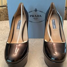 Prada Leather Platform Metallic Black /Gunmetal Pumps. Never Worn. With Original Dust Bag And Box, Eu Size 40, Us 10 Luxury Heels With Metallic Accents For Formal Occasions, Designer Metallic Leather Heels, Shoes Prada, Prada Leather, Prada Shoes, Platform Pumps, Black Pumps, Prada, Dust Bag