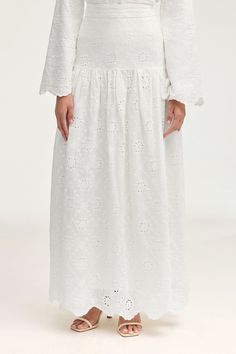 Halima White Eyelet Maxi Skirt Clothing Veiled Feminine Tiered Skirt For Daywear, Flowy Lace Trim Midi Skirt, Feminine Long Skirt With Lace Trim, Feminine Daywear Skirt With Lace Trim, Flowy Lace Trim Maxi Skirt For Spring, Feminine Lace Trim Skirt For Daywear, Feminine Flared Skirt With Lace Trim, Feminine Tiered Skirt With Lace Trim, Lace Flowy Skirt For Daywear