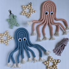 four octopus toys are shown with beads and tassels