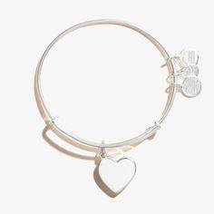 Wear the Heart Charm Bangle as a symbol of love and connection. Adjustable to fit any wrist, this charm bangle is a perfect gift for a loved one to honor any milestone or occasion. Love And Connection, Paw Print Charm, Bead Bangles, Wine Glass Charms, Bangle Bracelets With Charms, Cross Bracelet, Charm Bangle, Alex And Ani, Shiny Silver