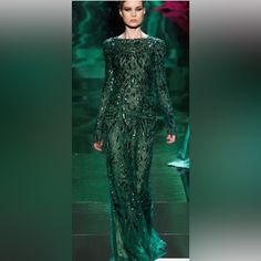 Make A Statement With This Stunning Monique Lhuillier Gown. This Beaded And Embroidered Long Sleeve Dress Features A Round Neckline And A Fit And Flare Style, Making It Perfect For Any Occasion, From Weddings To Formal Events. The Dress Comes In A Beautiful Green Color And Is A Size 6. It Is Ideal For Women Who Want To Look Elegant And Stylish Without Compromising On Comfort. The Dress's Long Length And Intricate Details Make It A Timeless Piece That You Will Cherish For Years To Come. This Gown Was Worn One Time Only And Is In Exceptional Excellent Condition. Green Embellished Cocktail Gown, Monique Lhuillier Gowns, Long Sleeve Embroidered Dress, Sleeve Gown, Long Sleeve Gown, Monique Lhuillier, Wedding Outfits, Intricate Details, Long Length