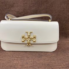 New With Tags And Dust Bag Height: 4.9" (12.5cm); Length: 9.3" (23.5cm); Depth: 1.6" (4cm) Tory Burch Bags, Tory Burch Bag, Tory Burch, Satchel, Dust Bag, Bag Lady, White Gold, Handbags, Tags