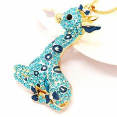 Betsey Johnson Giraffe Blue Rhinestone Gold NecklaceItem: Necklace Vendor: Betsey Johnson Necklace Chain Length: 27.5 Inches Pendant Dimensions: 2.68" x 1.73" (Inches) Color: Gold, Blue Metal: Alloy, Lead & Nickle Free Theme: Giraffe, Animals Measurements are approximate. Sold as One Individual Necklace. Fun pendants, flirty necklaces, bright brooches, and chunky bracelets do more than just add a touch of sparkle – they represent who you are. Betsey Johnson Jewelry does this beautifully with Betsey Johnson Necklace, Animal Prints Pattern, Chunky Bracelets, Necklace Chain Lengths, Betsey Johnson Jewelry, Blue Rhinestones, Sparkling Crystal, Necklace Chain, Do More