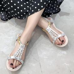 Department Name: AdultItem Type: SandalsUpper Material: PUSandal Type: GladiatorOccasion: CasualClosure Type: Elastic bandOutsole Material: RubberModel Number: WSS3039Insole Material: PUPattern Type: GeometricStyle: EthnicHeel Height: Low (1cm-3cm)Fashion Element: RivetBack Counter Type: Front & Rear StrapSide Vamp Type: OpenHeel Type: Flat withWith Platforms: NoLining Material: PUFit: Fits true to size, take your normal sizeBrand Name: THEAGRANT Trendy Flat Heel T-strap Sandals For Party, Flat Synthetic T-strap Sandals For Party, Gold T-strap Sandals With Round Toe For Party, Casual Gold Sandals For Party, Casual T-strap Sandals For Party With Single Toe Strap, Casual T-strap Sandals With Single Toe Strap For Party, Silver Sandals With Single Toe Strap In Synthetic, Trendy Flat T-strap Sandals For Parties, Silver T-strap Sandals For Summer Parties