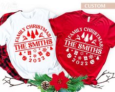 two matching family christmas t - shirts on display next to holly wreaths and pine cones