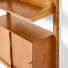 a wooden shelf with two open shelves on each side