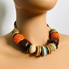 Tribal Necklace and Bracelet Set For Her, Wood Acrylic and Stone Beaded Necklace and 4 Bracelets, Tribal, Earth Nature African Inspired.  See our FAQ's for Jewellery care. Info:  Necklace 62g, B2B 17" with 3" Adjustable Bracelet 25g each, 4no Bracelets  See More Jewellery Sets here: https://www.etsy.com/uk/shop/AvoJuoJewellery?ref=seller-platform-mcnav§ion_id=43700948 See the rest of our store here: https://www.etsy.com/uk/shop/AvoJuoJewellery B2B - When unchained and laid out flat in a straight Unique Orange Jewelry With Wooden Beads, Orange Wooden Beads For Jewelry Making, Adjustable Orange Necklace With Wooden Beads, Adjustable Brown Beaded Round Necklace, Adjustable Brown Beaded Necklace, Adjustable Brown Round Beaded Necklace, Adjustable Round Brown Beaded Necklace, Brown Jewelry With Colorful Beads, Orange Jewelry With Round Wooden Beads