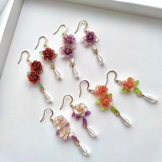 Handmade Colorful Rose Flower Earrings These unique handmade earrings feature a beautifulrose design. Crafted from high quality materials, they make a perfect gift for the special someone in your life. Show your loved one how much you care with these stunning rose earrings. Detail: - Size of earring: 50mm Material: flowers - resin; ear wires - sterling silver The Handmade Rose Flower Earrings are sold in pairs of two earrings. Dangle Flower Earrings With 3d Flowers For Gifts, Handmade Flower Drop Earrings As Gift, Gift Flower Dangle Earrings With 3d Flowers, Handmade Rose Flower Earrings Gift, Handmade Rose Flower Earrings For Gift, Whimsical Flower Earrings With Flower Charm As A Gift, Whimsical Flower Drop Earrings As Gift, Whimsical Flower Drop Earrings For Gifts, Gift Handmade Flower Earrings