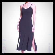 Size Info True To Size. S=6, M=8-10, L=10-12 Details & Care Long Slits Add Twirl-Worthy Movement To A Streamlined Dress In A Midi Length. 39" Center Front Length (Size Medium) Back Zip Closure Scooped Neck Adjustable Spaghetti Straps Lined 95% Polyester, 5% Spandex Black Longline Midi Dress For Party, Black Summer Dresses With Split Design, Black Split Design Dress For Summer, Black Summer Dress With Split Design, Black Longline Dress For Date Night, Elegant Black Longline Midi Dress, Chic Formal Midi Dress With Split, Chic Black Midi Dress With Side Slits, Black Party Dress With Flattering Cut