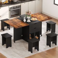 a kitchen table with four stools around it