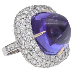 Handcrafted ring made in Italy of 18 kt. white gold with diamonds and tanzanite. This piece is part of the Diamond Collection Fraleoni and is one of a kind. The setting is made with pavé diamonds surrounding sugarloaf-cut tanzanite. 2015 Round-cut diamonds: ct. 10.94 ( H-I color / VVS1-VVS2 ) Tanzanite sugarloaf: ct. 54.00 Weight: gr. 34.40 Ring size: 9 The ring is re-sizeable. Golden Rings, Sparkling Jewelry, Diamond Collection, Golden Ring, Sparkle Jewelry, Diamond Cocktail Rings, Hrithik Roshan, Handcrafted Rings, Gem Stone