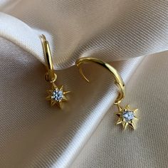 14K Gold plated 925 Sterling Silver Star hoop earrings. Minimalist style. Everyday jewelry made with love. ...............................DETAILS• 14K Gold Plated • 925 Sterling Silver • AAA Cubic Zirconia Stone• Also available in 14K White Gold...............................MEASURESHoop Diameter: 16mm (1.6cm) Charm Size:10mm (1cm) Celestial Style Gold-plated Yellow Gold Hoop Earrings, Celestial Style Yellow Gold Plated Hoop Earrings, Gold Plated Star Hoop Earrings Tarnish Resistant, Gold Plated Star Hoop Earrings, Gold Celestial Dangle Huggie Earrings, Gold Celestial Huggie Earrings For Everyday, Celestial Gold Plated Tarnish Resistant Hoop Earrings, Celestial Gold-plated Tarnish Resistant Hoop Earrings, Celestial Gold-plated Tarnish-resistant Hoop Earrings