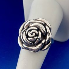 * Fun 925 Sterling Silver Textured Rose Camellia Flower Fashion Ring * Ring size: 8.75 * Top of ring measures: 7/8" x 7/8" * Band Width: 1/8" * Height: 1/4" * Weight: 5.6 g * Marked: 925 * Condition: Great. (225bluetopdupboxbr) * S1148    Exported By ExportYourStore :) Rose Design Flower Ring For Anniversary, Adjustable Sterling Silver Rose Design Ring, Adjustable Sterling Silver Flower Ring With Rose Design, Elegant Adjustable Flower Ring With Roses, Elegant Adjustable Rose Flower Ring, Formal Rose Design Flower Ring, Sterling Silver Rose Design Flower Ring, Silver Flower-shaped Rings With Rose Design, Adjustable Flower-shaped Ring With Rose Design