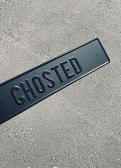 there is a black sign that says ghosted on it