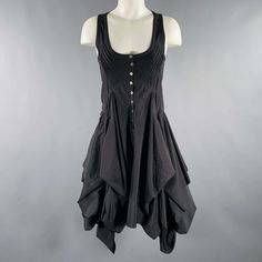 Allsaints Dress In A Black Polyester Blend Fabric Featuring A Tank Style With Pleated Bodice Details, Asymmetrical Skirt, And Front Button Closure. Excellent Pre-Owned Condition. Marked: Eu 36 Measurements: Shoulder: 11 Inches Bust: 30 Inches Waist: 28 Inches Hip: 40 Inches Length: 40 Inches Sui Generis Reference: 131846 Category: Dress More Details Brand: Allsaints Gender: Female Size: 4 Color: Black Fabric: Polyester Blend Material: Polyester Style: Asymmetrical Age Group: Adult Sui Generis De Summer Fitted Midi Dress By Allsaints, Spring Midi Dress By Allsaints, Chic Summer Midi Dress By Allsaints, Chic Allsaints Summer Midi Dress, Chic Allsaints Midi Dress For Spring, Chic Allsaints Spring Midi Dress, Chic Spring Midi Dress By Allsaints, Allsaints Chic Spring Midi Dress, Allsaints Fitted Midi Dress