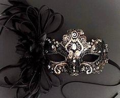 Masquerade mask in black gold. Simplistic for woman with a black floral- destined to pop out at any event, wedding etc This masquerade mask is great for any occasion. Masquerade Ball Black Women, Black Masquerade Mask Aesthetic, Black Eye Mask For Evening Masquerade, Black Masquerade Mask For Halloween Wedding, Elegant Formal Mask For Carnival, Elegant Eye Mask For Masquerade, Elegant Eye Mask For Formal Masquerade, Elegant Formal Masks For Carnival, Elegant Black Masquerade Mask For Halloween