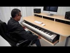 a man sitting in front of a keyboard