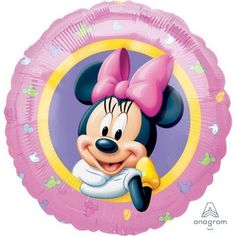 a pink foil balloon with a cartoon minnie mouse on it's face and a bow in her hair