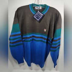 Nwt Vintage 1980s Fila Men’s 50% Wool / 50% Acrylic Knit Tennis Sweater Size: 38 Color: Green, Blue, Gray Comes In Original Bag! Measurements Contained In Pics Above! I Will Ship This Item Out Via Usps Priority 2-5 Day Mail With A Tracking Number For Confirmation I Ship Items Out Every Day So Expect A Quick Delivery! Please Feel Free To Ask Any Questions You May Have I Answer Most Questions Within 4 Hours During Business Hours East Coast Time! Shipping: All Items Are Picked Up From Our Warehouse Retro Blue Winter Top, Retro Blue Sweater With Relaxed Fit, 90s Style Blue Cotton Sweater, Cheap Vintage Blue Sweater, Retro Blue Crew Neck Sweater, Blue Retro Crew Neck Sweater, 90s Blue Winter Sweater, Retro Blue Long Sleeve Sweater, Blue Long Sleeve Retro Sweater