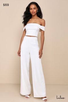 You'll only get more and more fabulous throughout the night while wearing the Lulus Exponentially Chic Ivory Off-the-Shoulder Two-Piece Jumpsuit! Stretchy crepe knit shapes this sensational two-piece jumpsuit that starts with an ultra-cropped top with a princess-seamed bodice and a folded-over, off-the-shoulder neckline (with hidden no-slip strips) that flows into short sleeves. The matching bottoms have a high, banded waist and wide pant legs that finish at full-length hems. An exposed silver z Strapless Off-shoulder Jumpsuit For Spring Formal, Formal Spring Strapless Off-shoulder Jumpsuit, White Off-shoulder Evening Jumpsuits And Rompers, Elegant One-shoulder Jumpsuit For Going Out, White Off-shoulder Jumpsuits And Rompers For Evening, Elegant One Shoulder Jumpsuit For Going Out, Formal Spring Strapless Jumpsuit, Elegant Off-shoulder Strapless Jumpsuit For Spring, Spring Party Off-shoulder Jumpsuits And Rompers