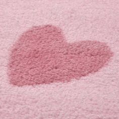 a pink rug with a heart drawn on it