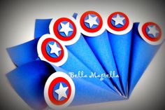 some blue paper with red and white stars in the shape of captain america's shield